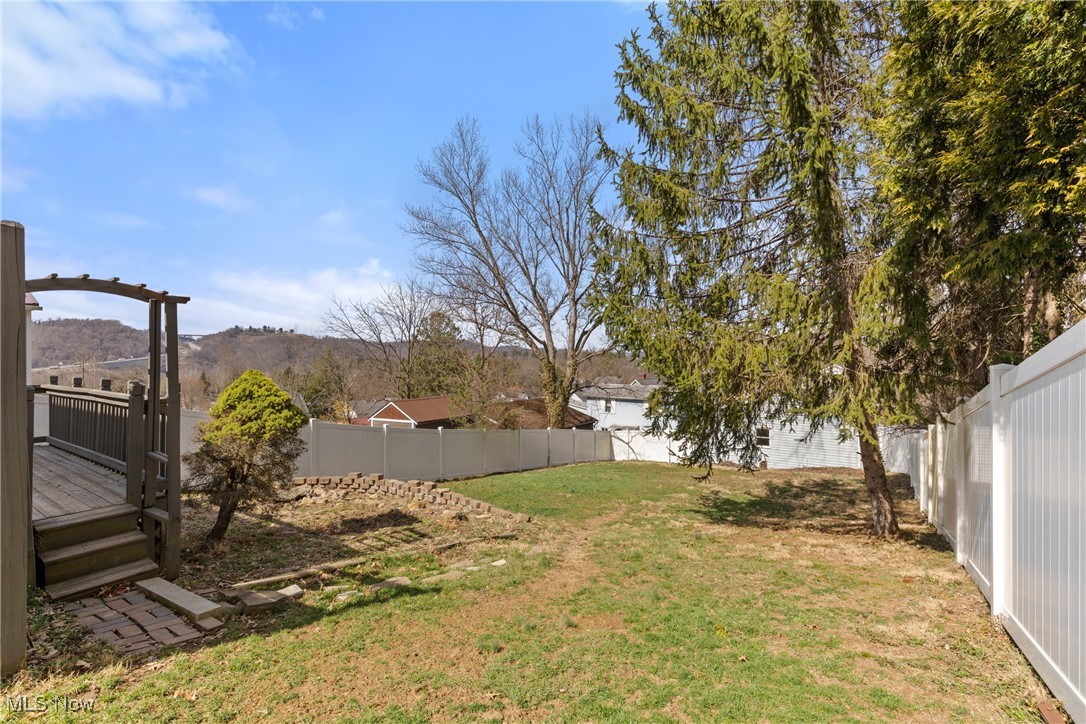 133 Harding Avenue Wheeling, WV 26003 - Photo 22 of 29 View of yard with a fenced backyard and a wooden deck