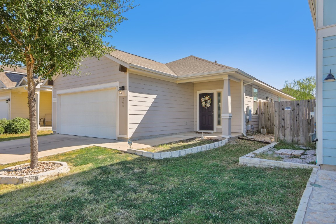 344 Guemal Road Buda, TX 78610 - Photo 1 of 1 a view of a house with backyard and garden