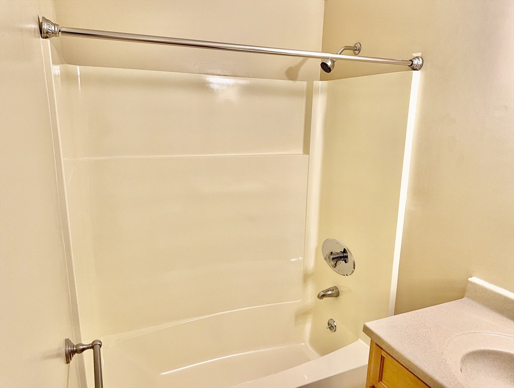 4700 North Main Street, Unit 3E Fall River, MA 02720 - Photo 8 of 9 a bathroom with a shower and a bath tub