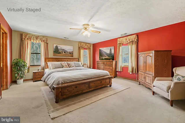 a view of an empty room with a ceiling fan
