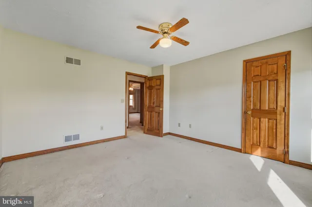 a view of workspace with furniture and a window