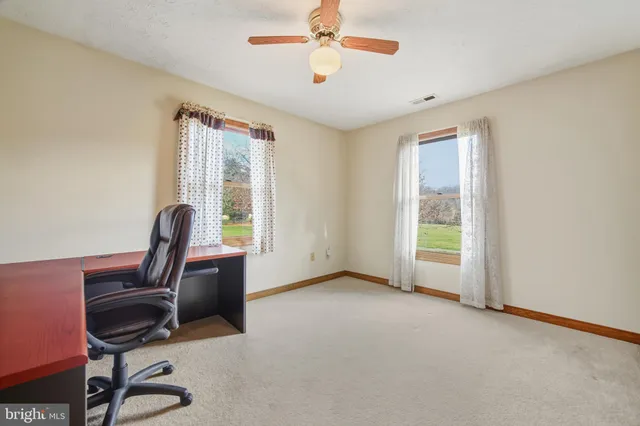 a workspace with furniture and a window