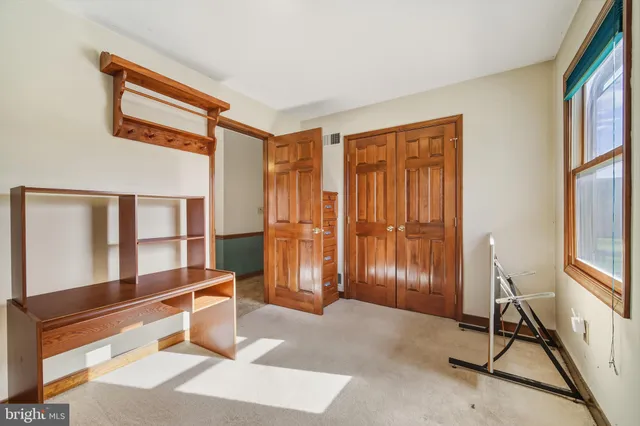 a bathroom with a granite countertop sink a large mirror and vanity