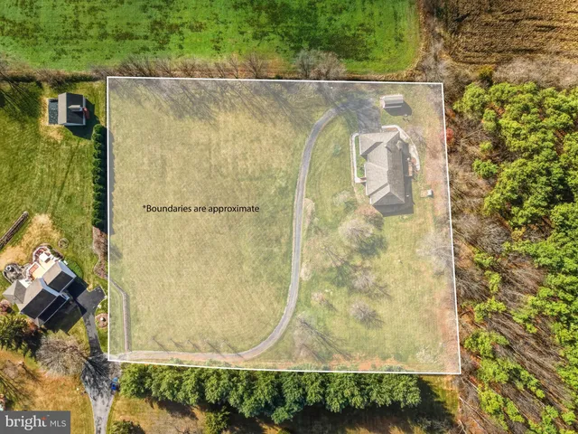 a large kitchen with a table and chairs
