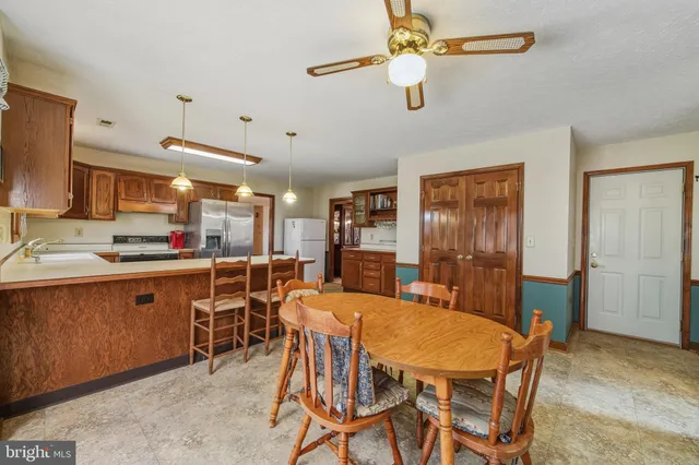 a dining room with furniture and window