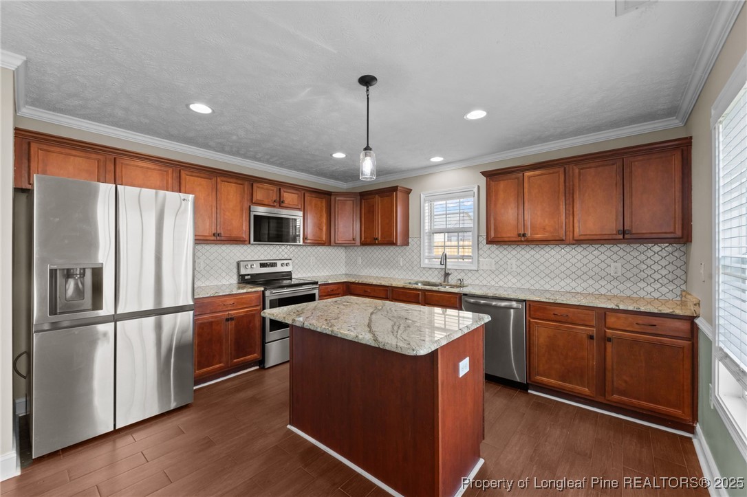 619 Cape Fear Road Raeford, NC 28376 - Photo 11 of 23 a kitchen with stainless steel appliances granite countertop refrigerator sink and microwave