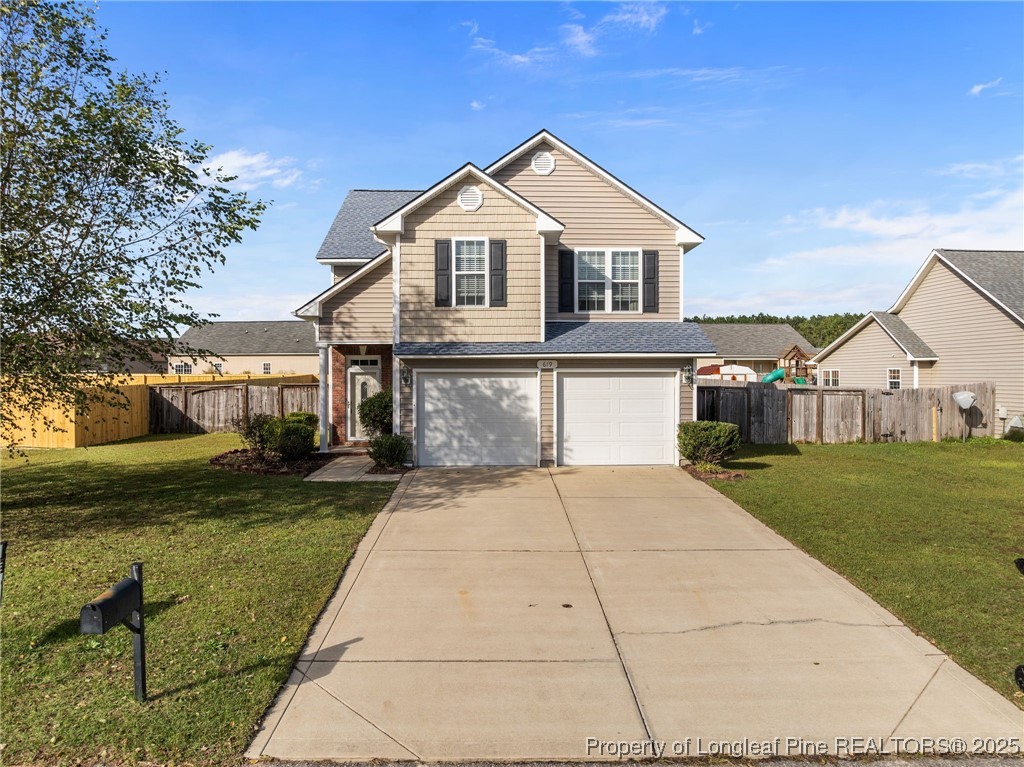 619 Cape Fear Road Raeford, NC 28376 - Photo 2 of 23 a front view of a house with a yard