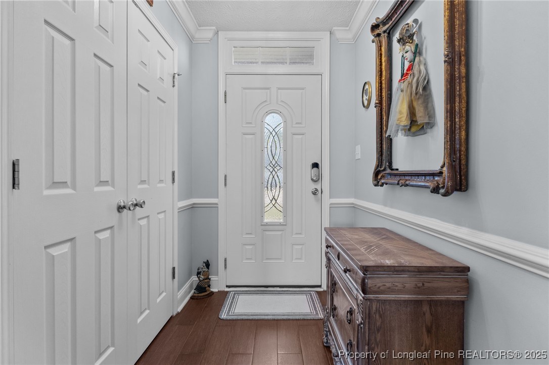 619 Cape Fear Road Raeford, NC 28376 - Photo 4 of 23 a view of an entryway with wooden floor