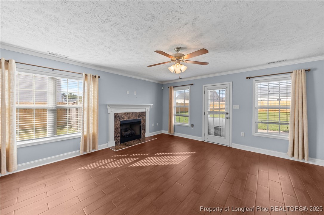 619 Cape Fear Road Raeford, NC 28376 - Photo 6 of 23 a view of an empty room with a window and wooden floor