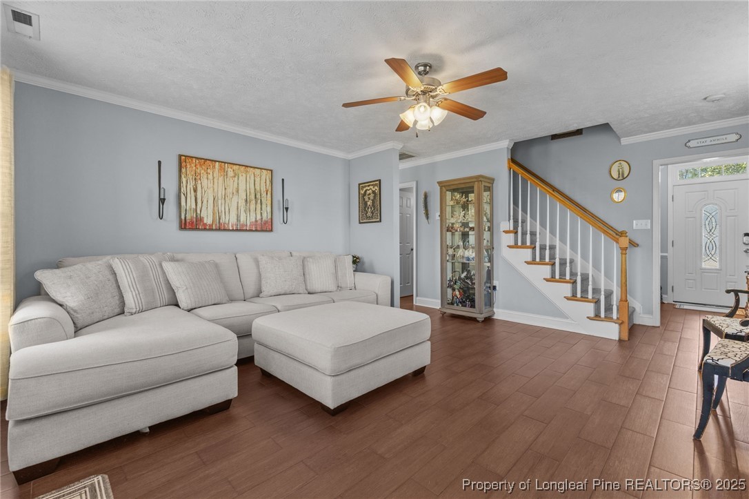 619 Cape Fear Road Raeford, NC 28376 - Photo 8 of 23 a living room with furniture and a wooden floor