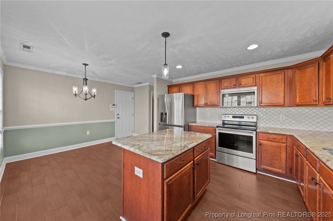 619 Cape Fear Road Raeford, NC 28376 - Photo 10 of 23 a kitchen with stainless steel appliances granite countertop a sink stove and refrigerator