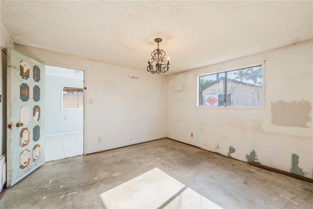 22428 Neptune Avenue Carson, CA 90745 - Photo 21 of 36 wooden floor in an empty room with a window