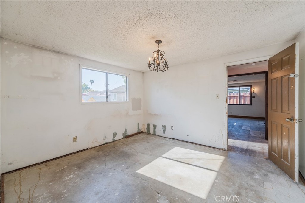 22428 Neptune Avenue Carson, CA 90745 - Photo 22 of 36 an empty room with windows and closet