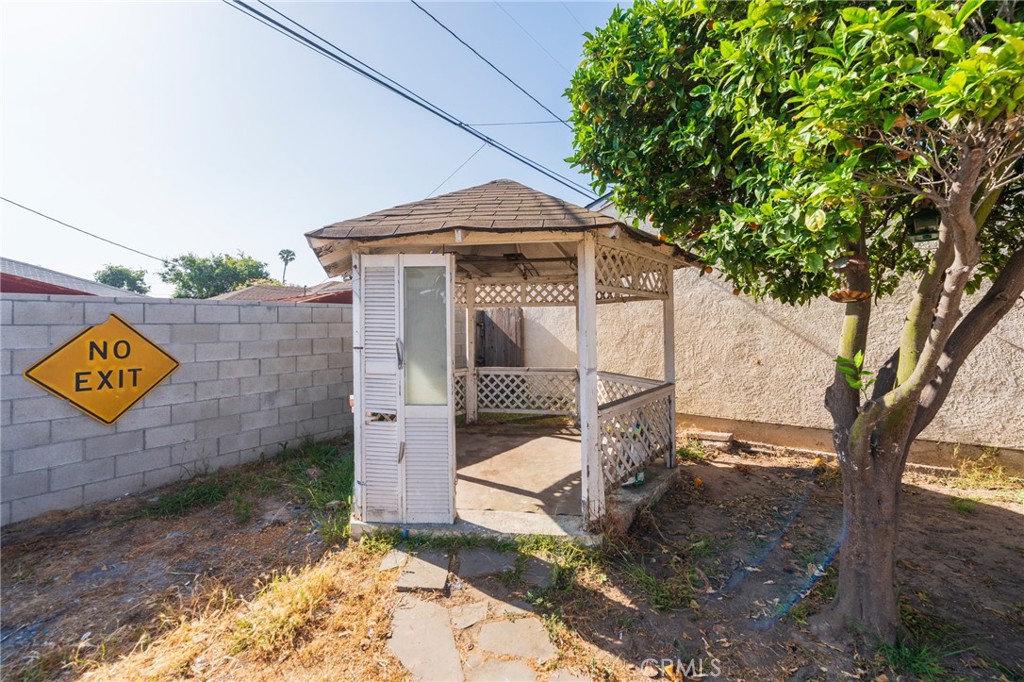 22428 Neptune Avenue Carson, CA 90745 - Photo 30 of 36 a view of a house with a yard