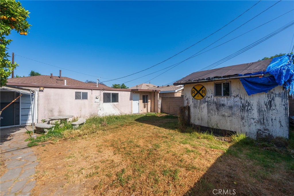 22428 Neptune Avenue Carson, CA 90745 - Photo 31 of 36 a view of a house with a yard