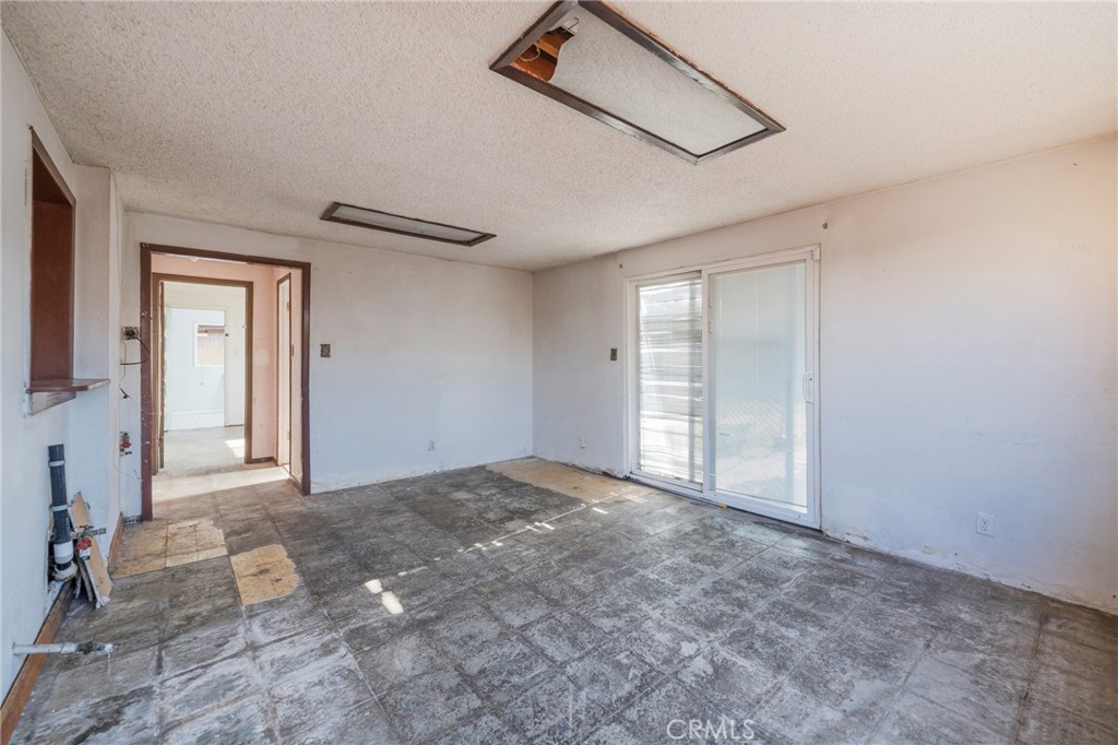 22428 Neptune Avenue Carson, CA 90745 - Photo 6 of 36 a view of an empty room and window