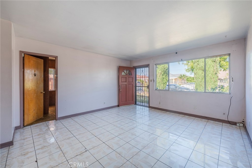 22428 Neptune Avenue Carson, CA 90745 - Photo 9 of 36 an empty room with windows