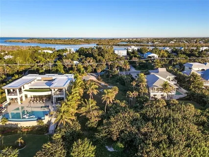 a view of a swimming pool with a table and chairs