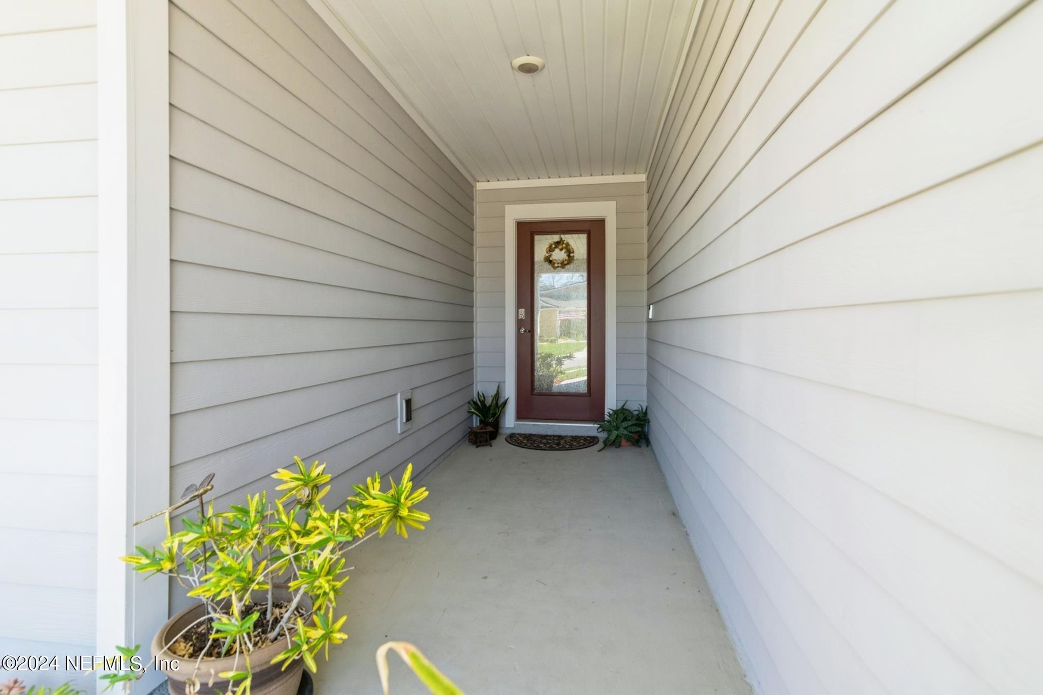 97 Spotted Owl Lane St. Augustine, FL 32095 - Photo 12 of 38 a view of an front door and wooden floor