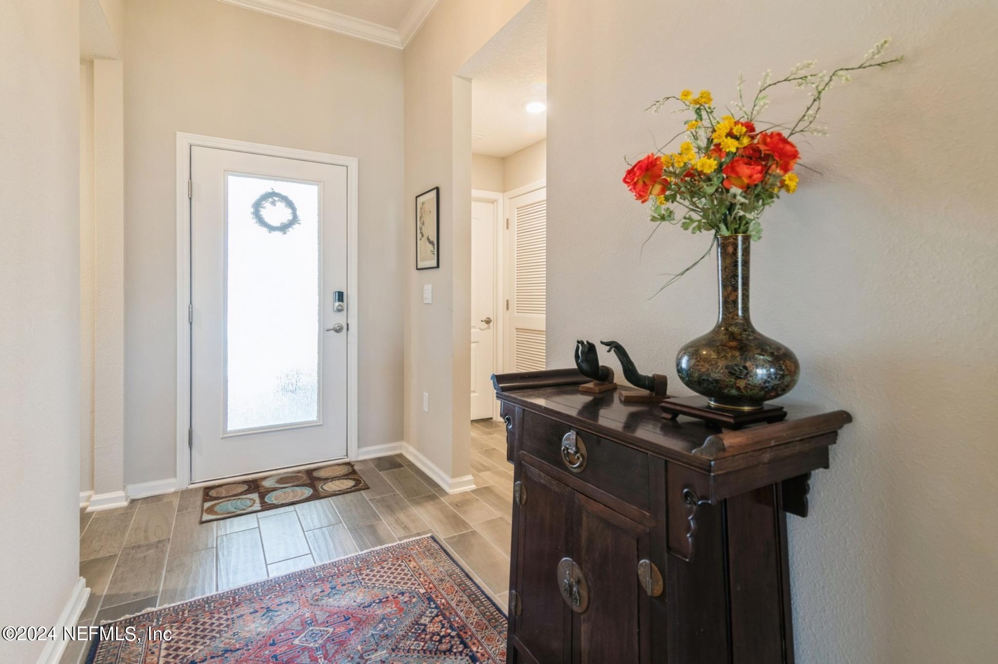 97 Spotted Owl Lane St. Augustine, FL 32095 - Photo 14 of 38 a living room with furniture and flowers