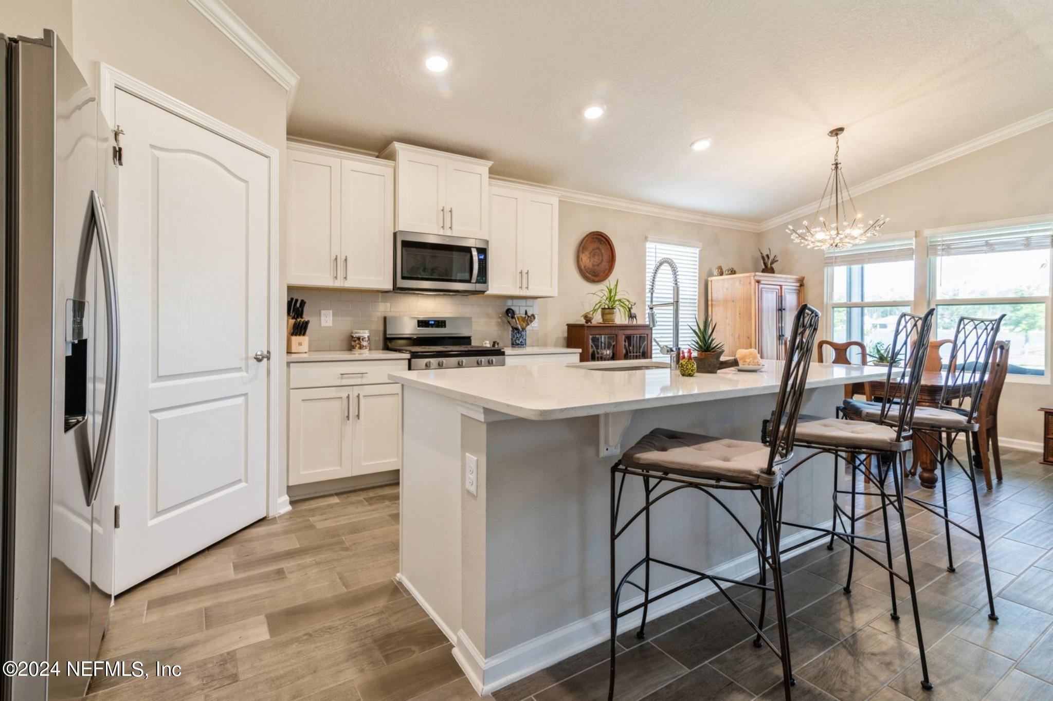 97 Spotted Owl Lane St. Augustine, FL 32095 - Photo 15 of 38 a kitchen with appliances a sink and cabinets