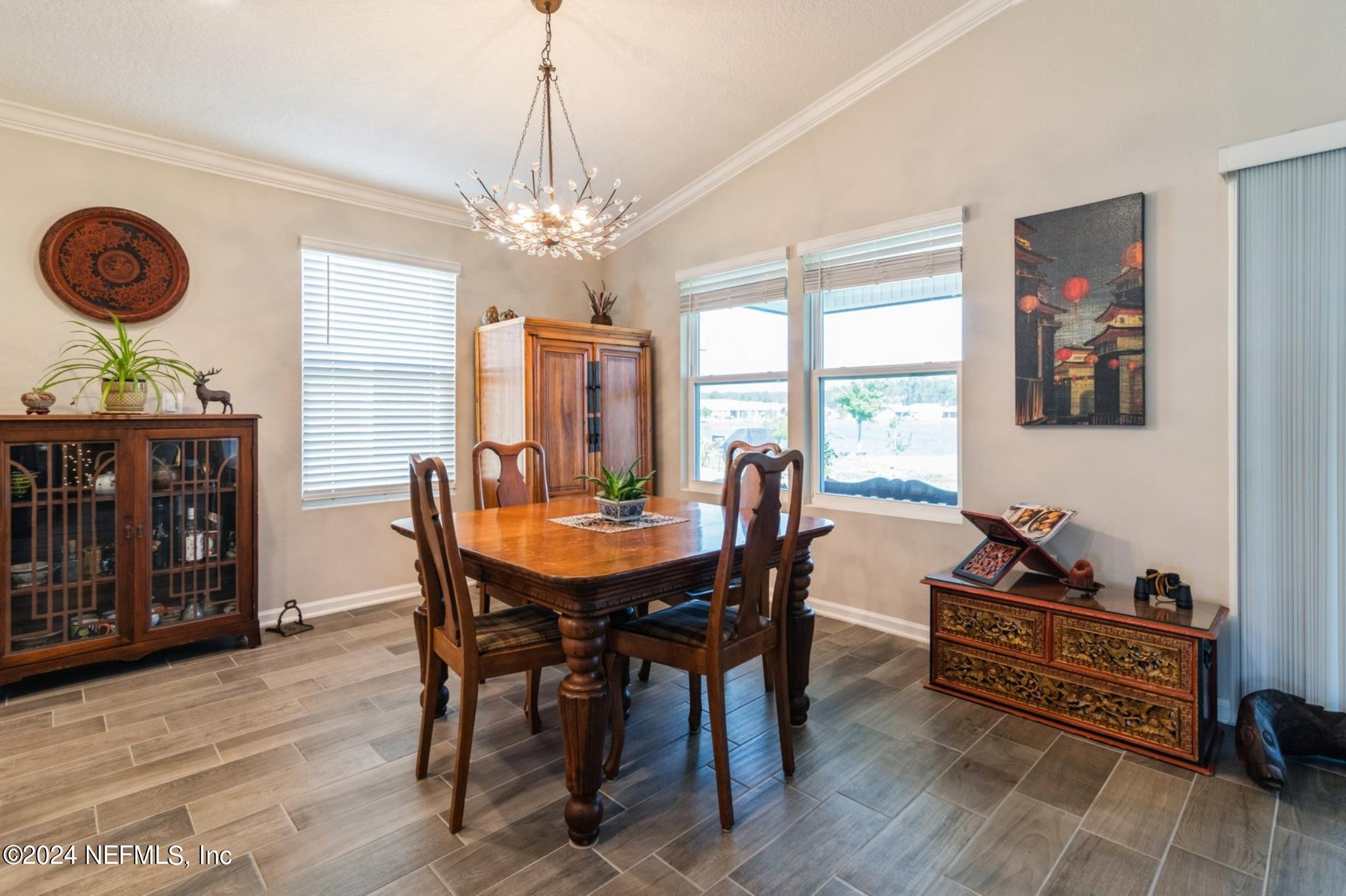 97 Spotted Owl Lane St. Augustine, FL 32095 - Photo 20 of 38 a view of a dining room with furniture window and wooden floor