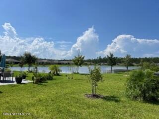 97 Spotted Owl Lane St. Augustine, FL 32095 - Photo 2 of 38 a backyard of a house with lots of green space
