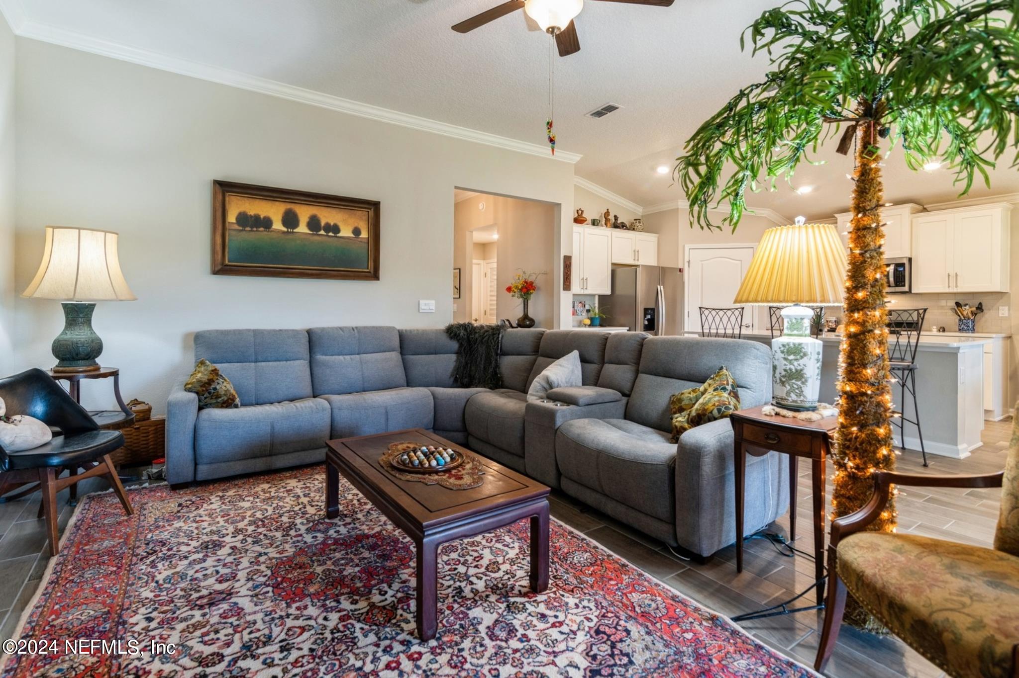 97 Spotted Owl Lane St. Augustine, FL 32095 - Photo 23 of 38 a living room with furniture a lamp and a table