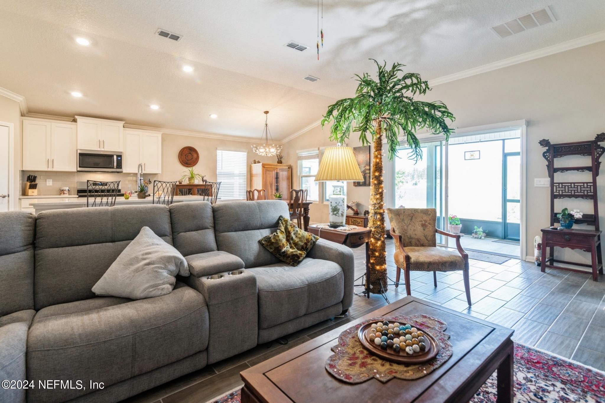 97 Spotted Owl Lane St. Augustine, FL 32095 - Photo 24 of 38 a living room with furniture and a large window