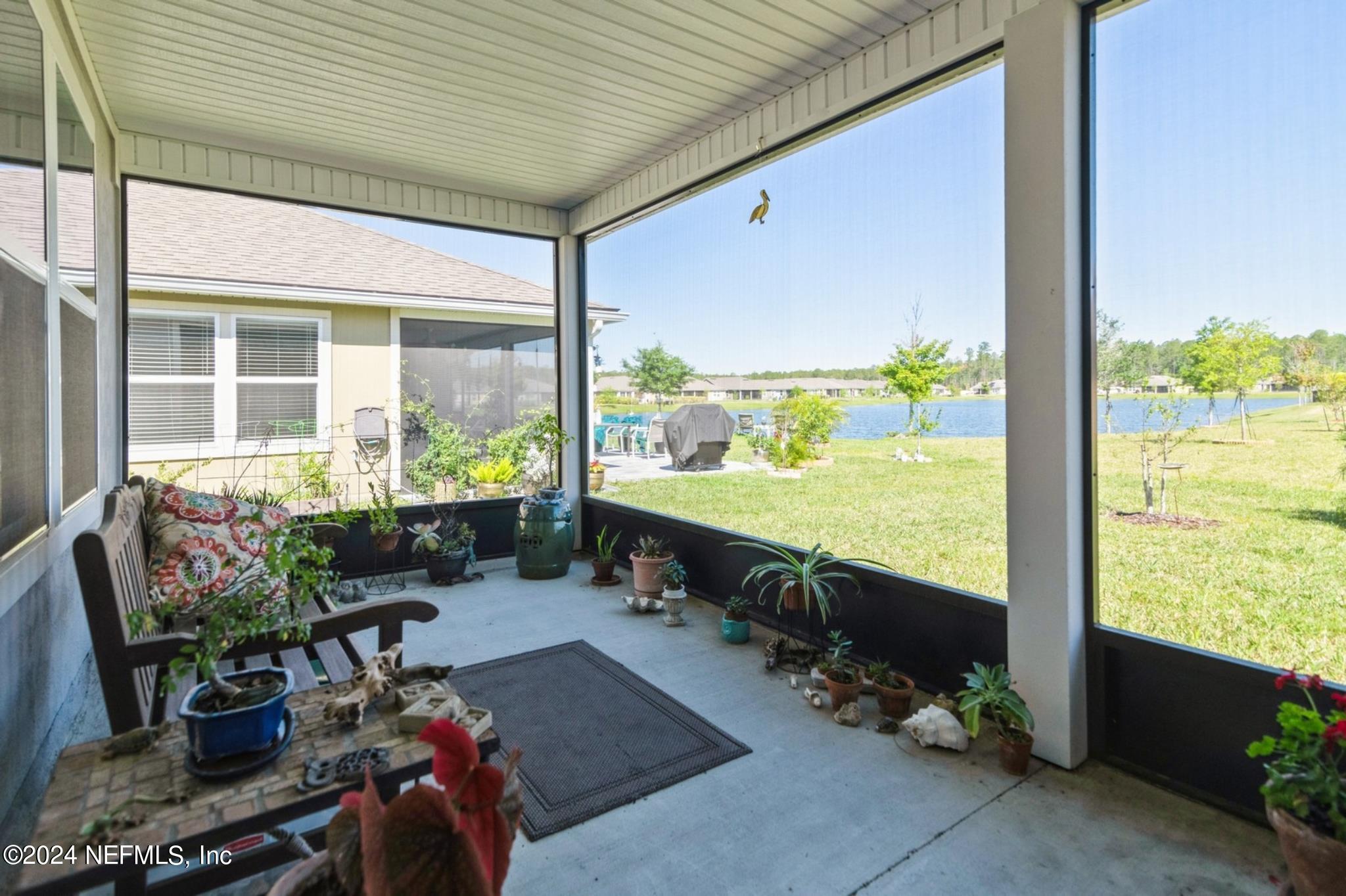 97 Spotted Owl Lane St. Augustine, FL 32095 - Photo 25 of 38 a living room with patio