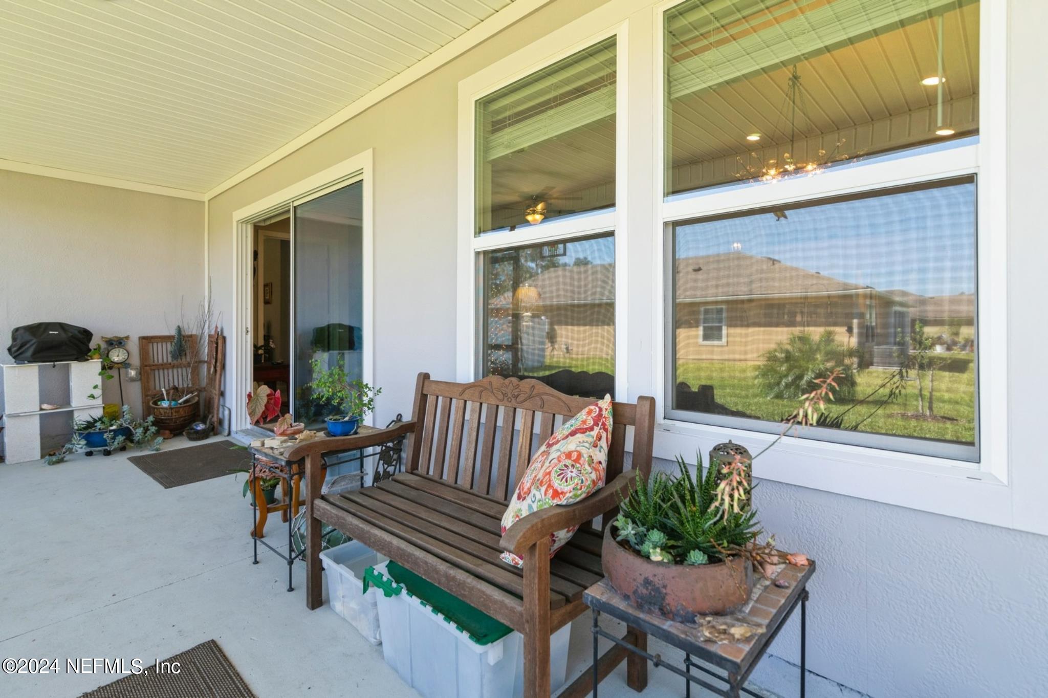 97 Spotted Owl Lane St. Augustine, FL 32095 - Photo 26 of 38 a building outdoor space with patio the couches and a potted plant on a table