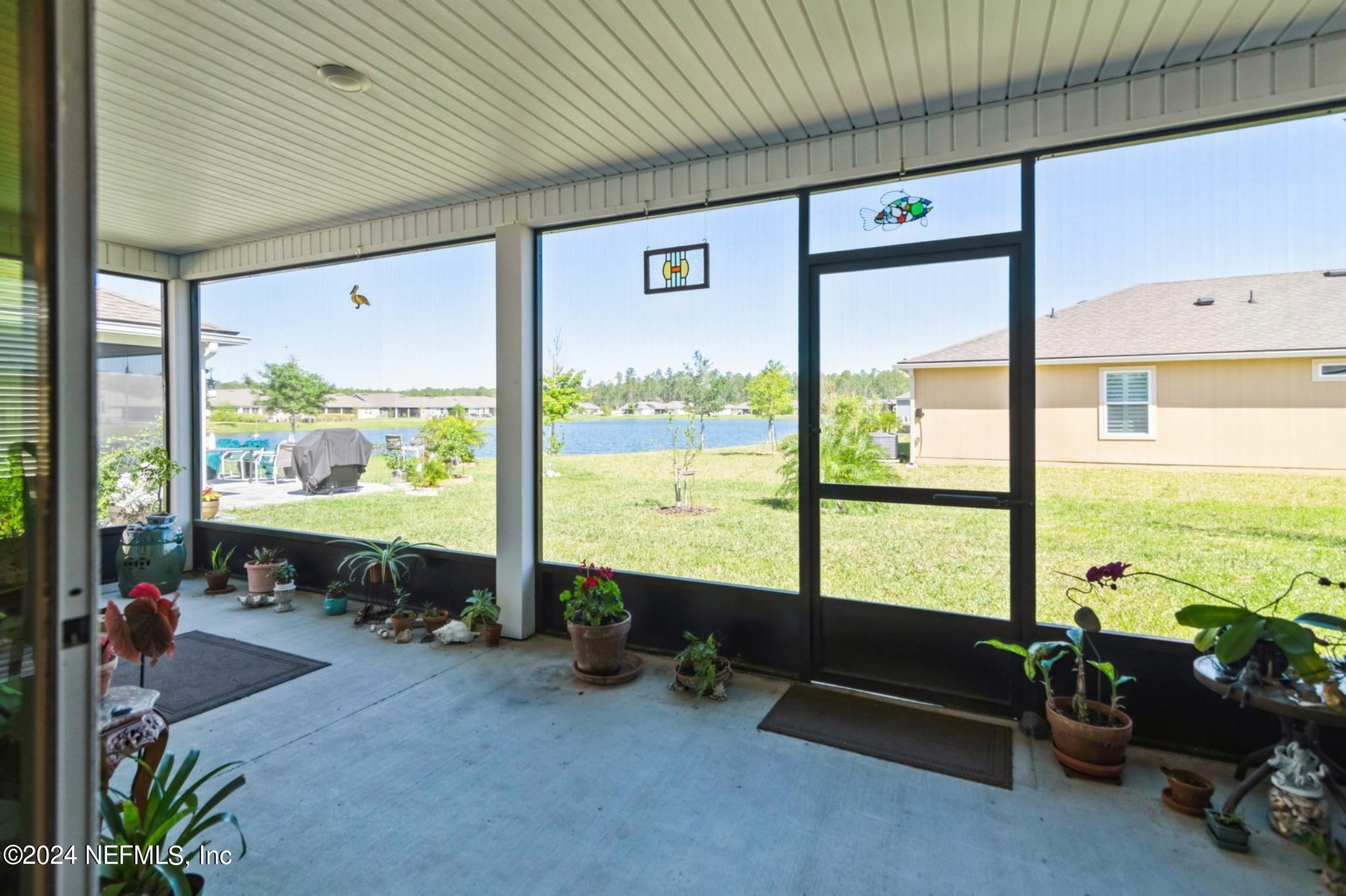 97 Spotted Owl Lane St. Augustine, FL 32095 - Photo 3 of 38 a living room with furniture and floor to ceiling window