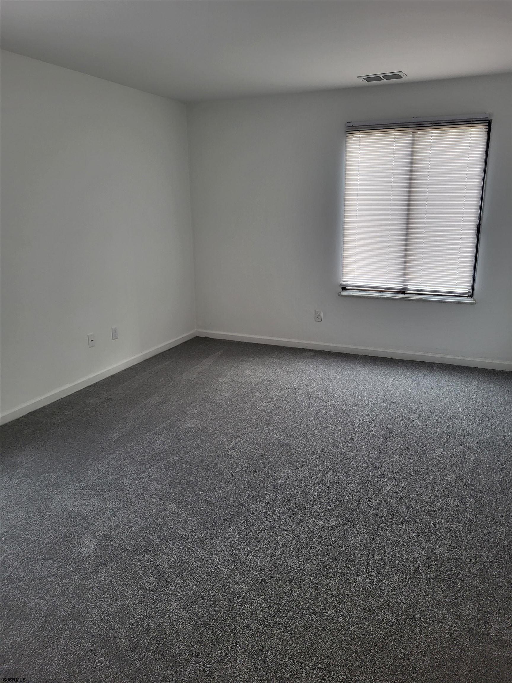151 Fair Haven Hill Court, Unit 151 Galloway Township, NJ 08205 - Photo 13 of 21 an empty room with a window