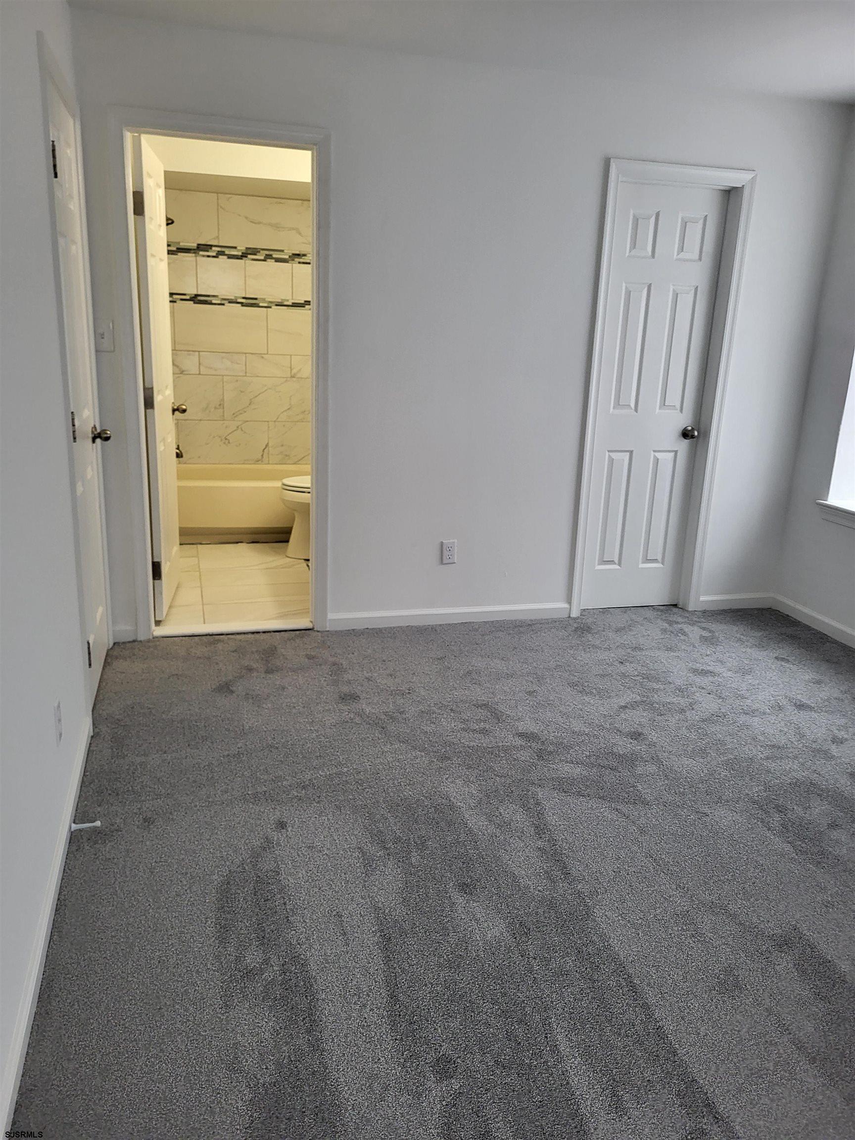 151 Fair Haven Hill Court, Unit 151 Galloway Township, NJ 08205 - Photo 14 of 21 an empty room with windows