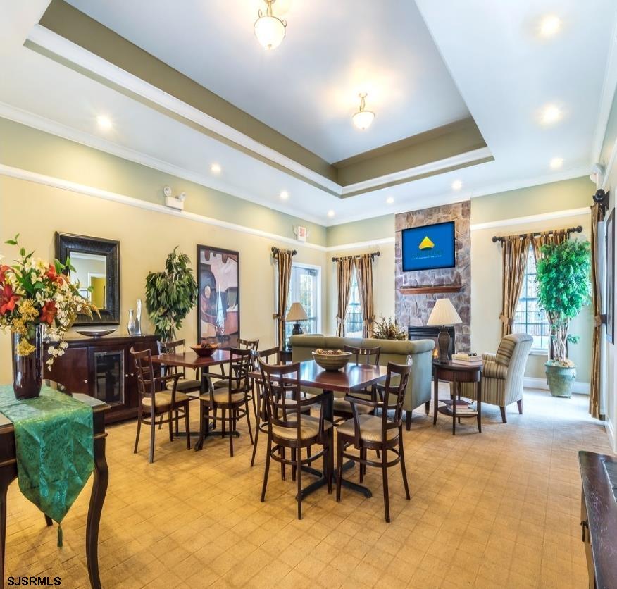 151 Fair Haven Hill Court, Unit 151 Galloway Township, NJ 08205 - Photo 21 of 21 a view of a dining room with furniture window and outside view