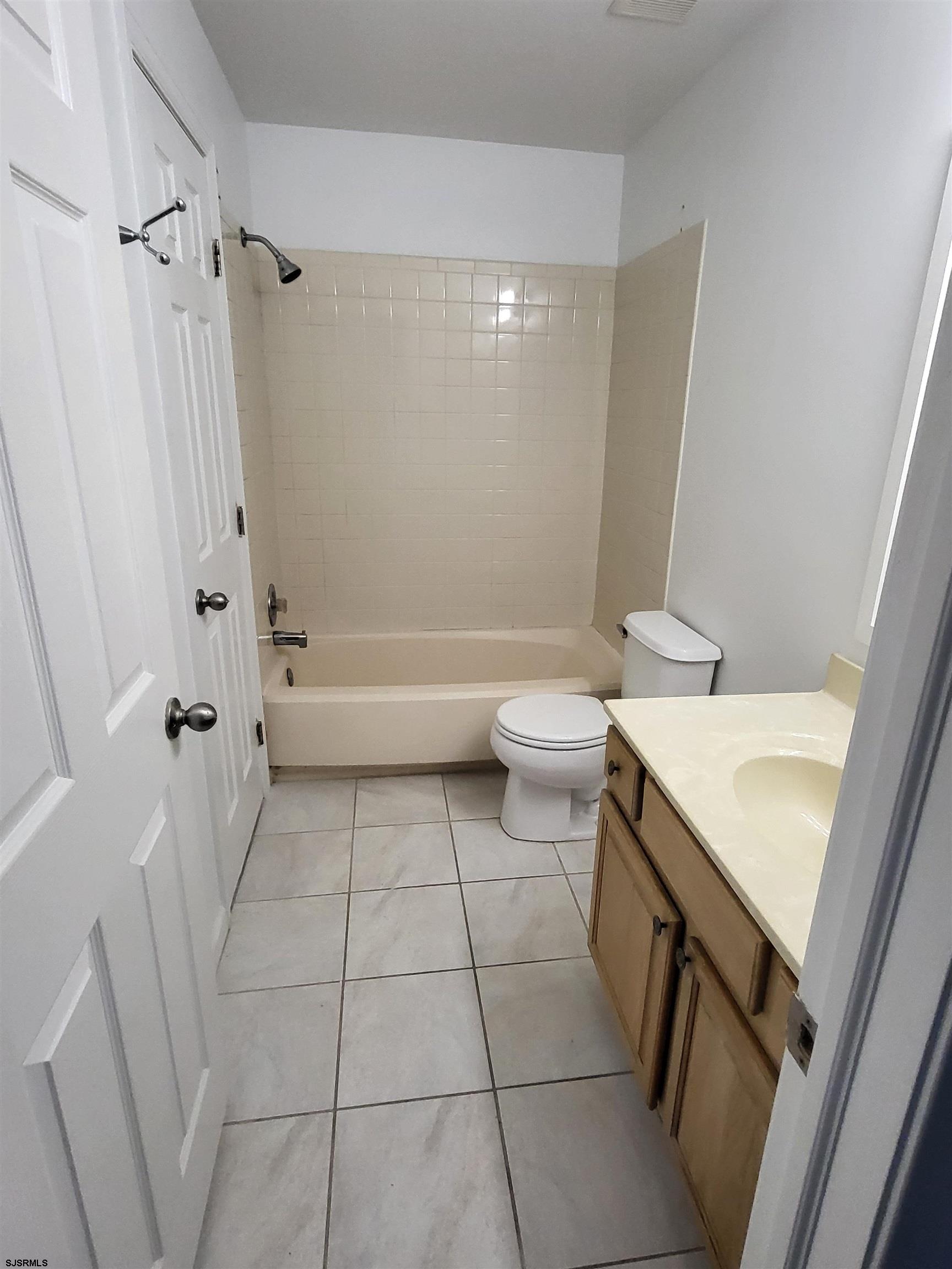 151 Fair Haven Hill Court, Unit 151 Galloway Township, NJ 08205 - Photo 8 of 21 a bathroom with a sink a toilet a mirror and shower