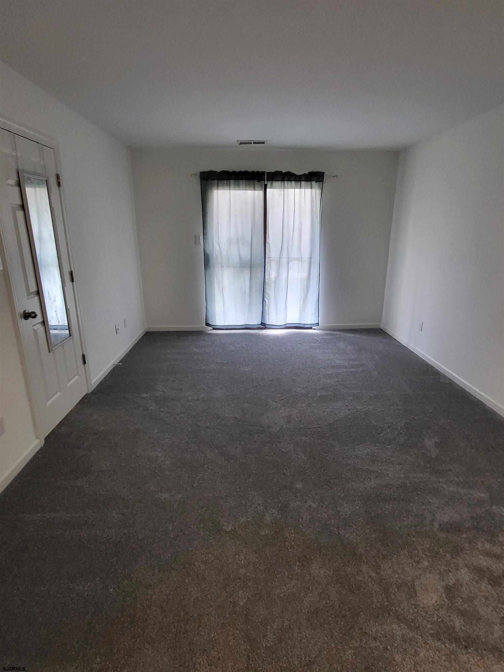 151 Fair Haven Hill Court, Unit 151 Galloway Township, NJ 08205 - Photo 10 of 21 an empty room with windows