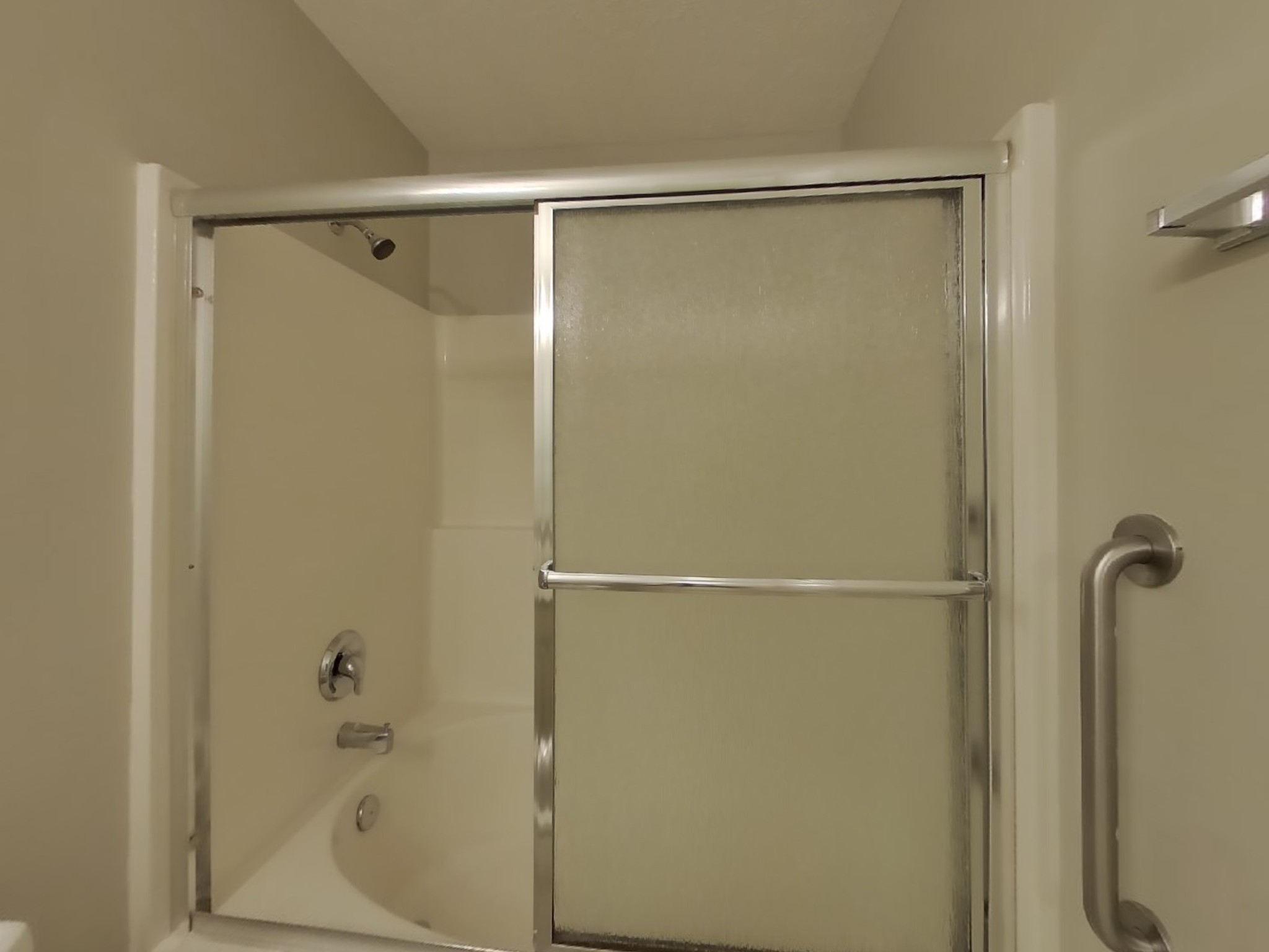 3504 Flora Drive Spring Hill, TN 37174 - Photo 11 of 18 a bathroom with a glass shower door