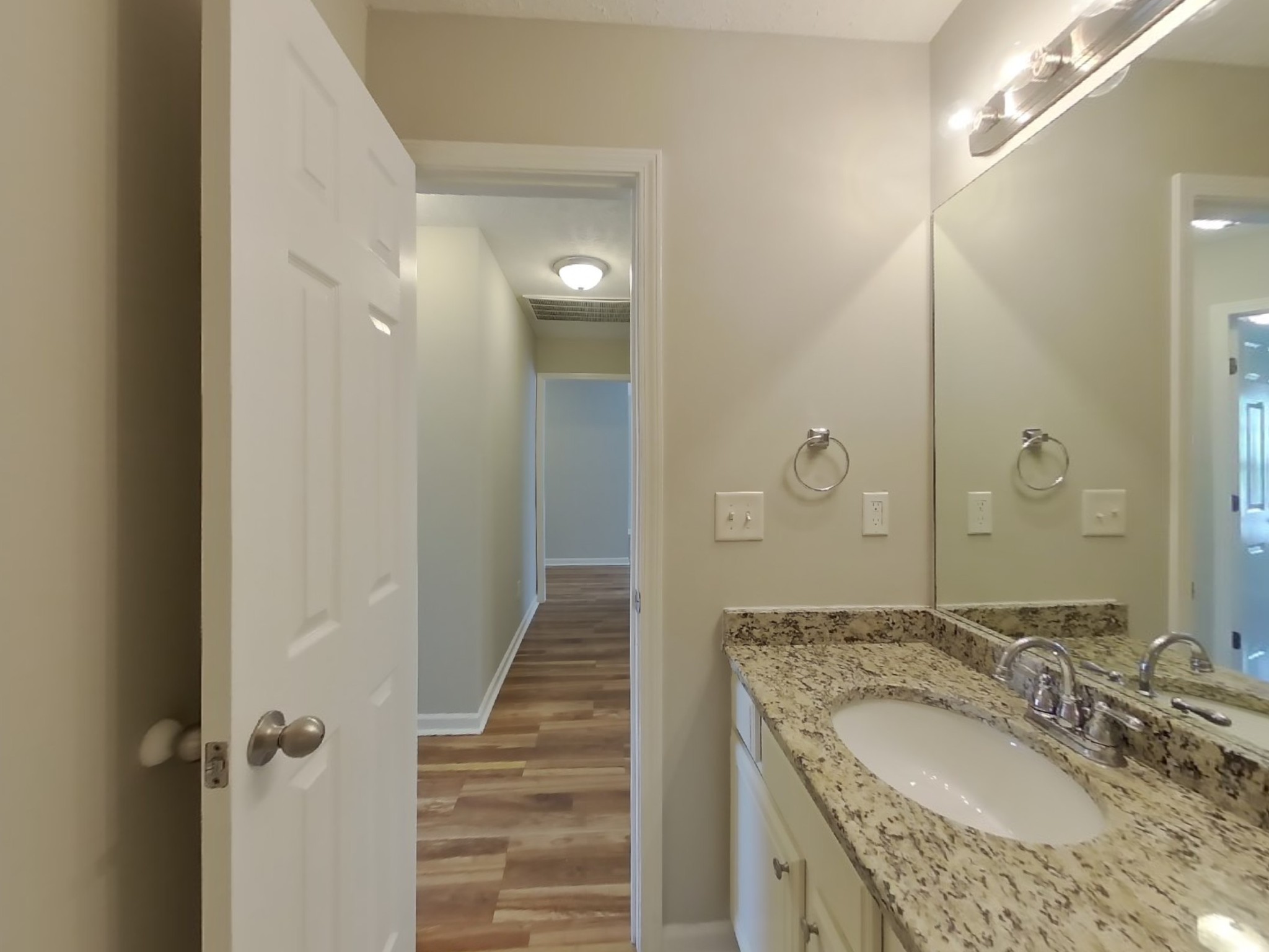 3504 Flora Drive Spring Hill, TN 37174 - Photo 16 of 18 a bathroom with a granite countertop sink a mirror and a shower