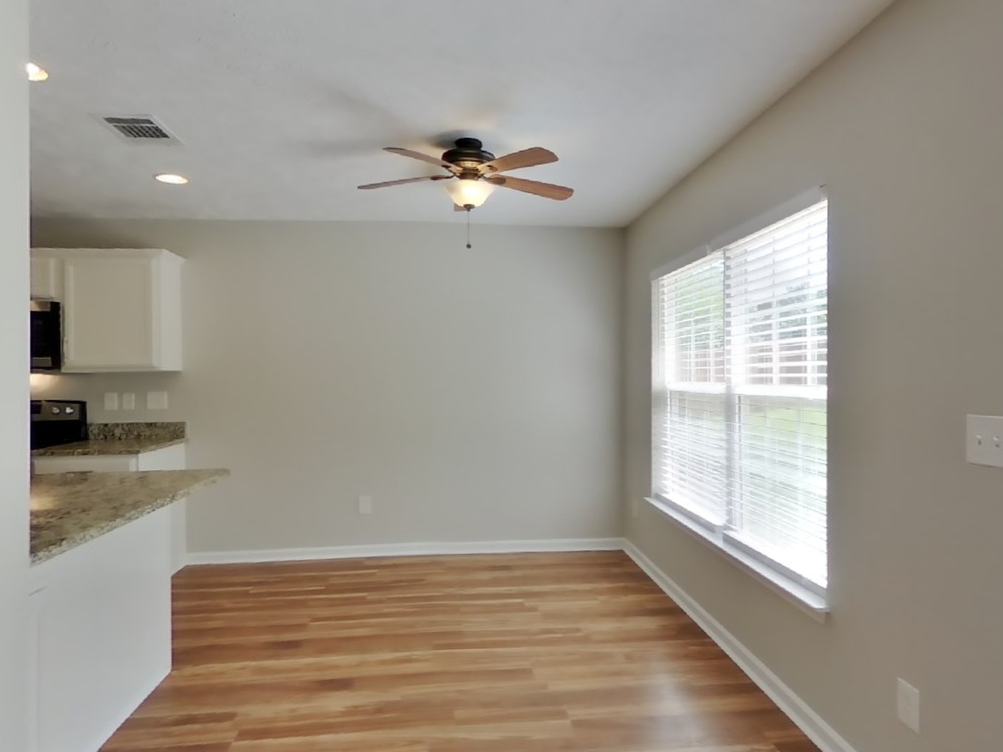 3504 Flora Drive Spring Hill, TN 37174 - Photo 4 of 18 wooden floor in an empty room with a window