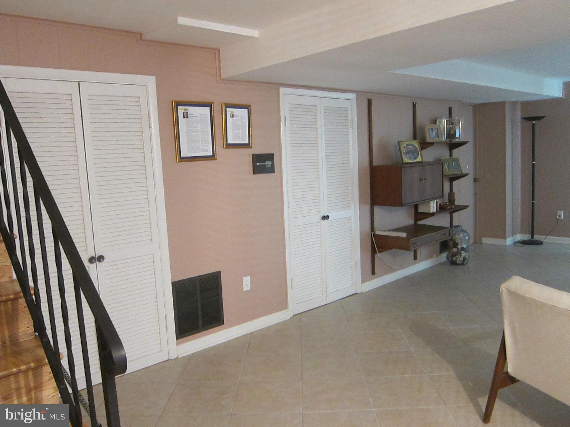 1803 Briggs Road Silver Spring, MD 20906 - Photo 11 of 19 a view of a livingroom with furniture and workspace