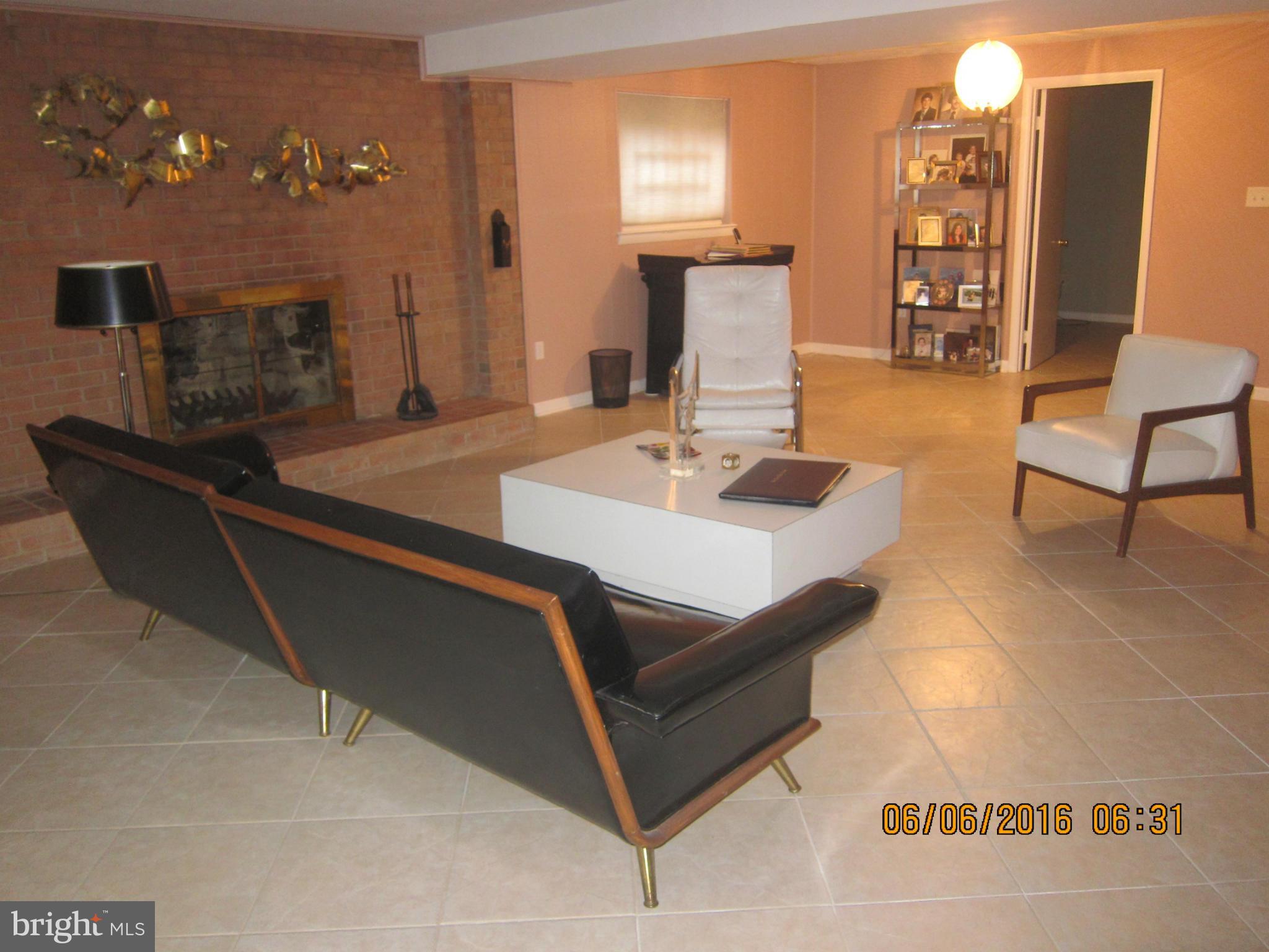 1803 Briggs Road Silver Spring, MD 20906 - Photo 13 of 19 a living room with furniture and wooden floor