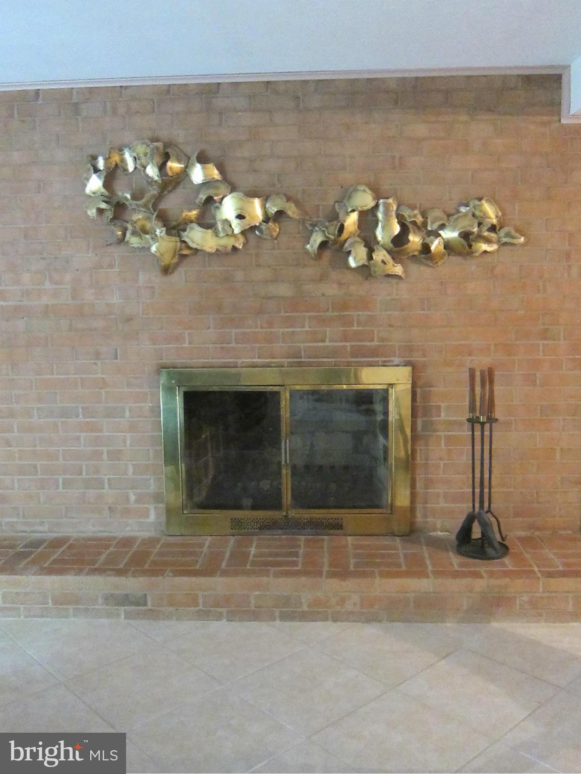1803 Briggs Road Silver Spring, MD 20906 - Photo 14 of 19 a view of a fireplace with wooden floor