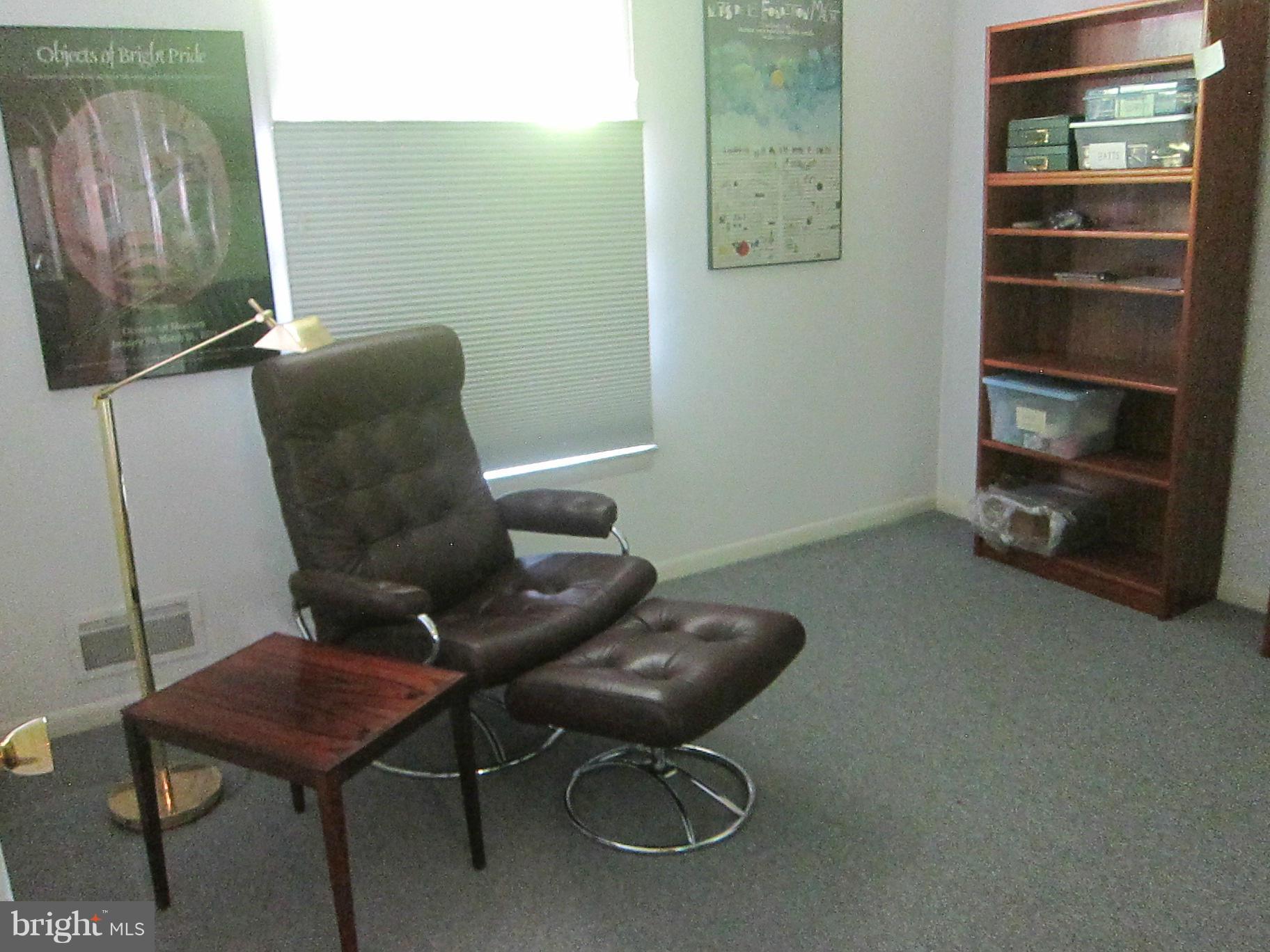 1803 Briggs Road Silver Spring, MD 20906 - Photo 17 of 19 a room with furniture and a flat screen tv