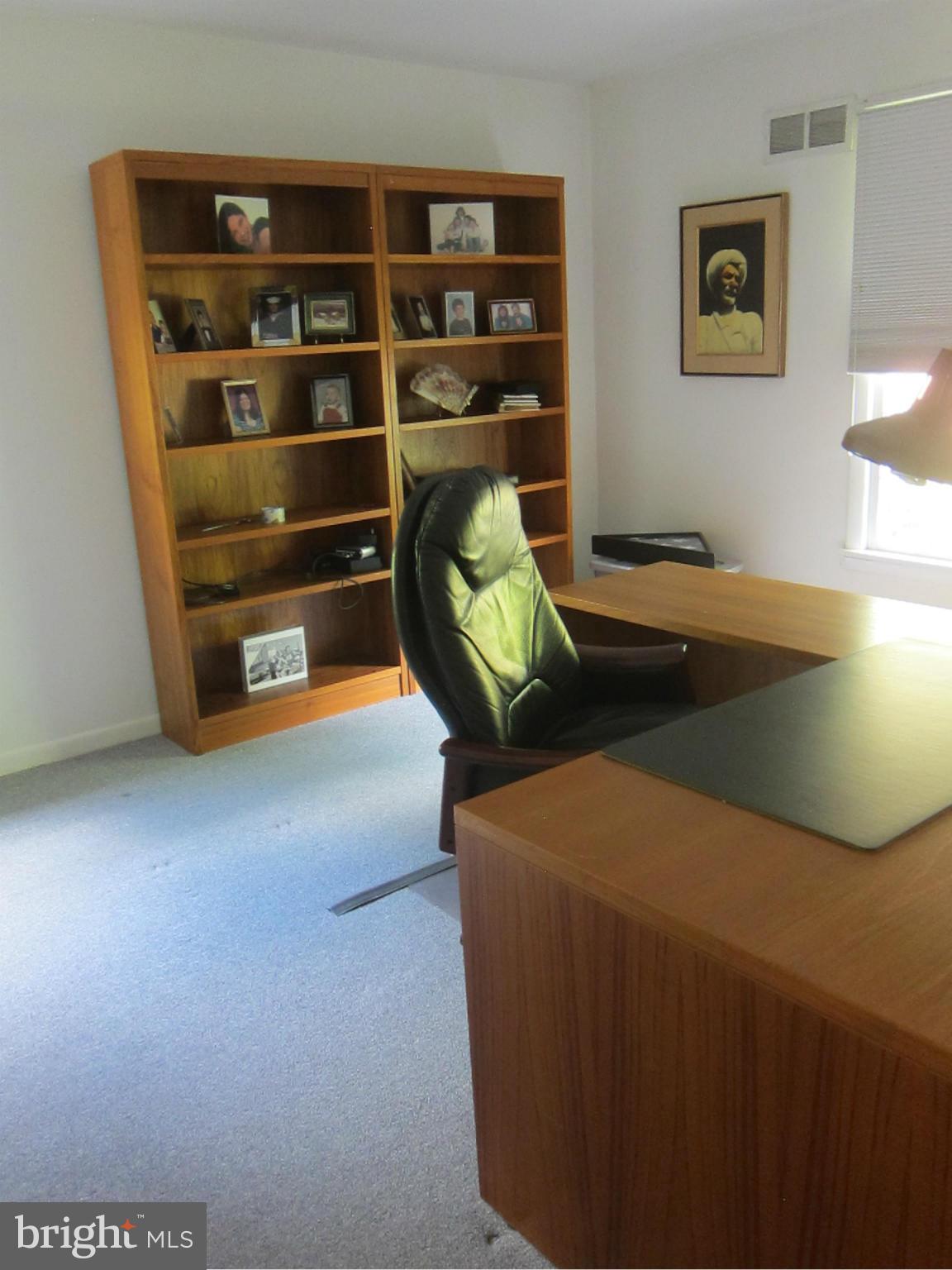 1803 Briggs Road Silver Spring, MD 20906 - Photo 18 of 19 a room with furniture and shoes