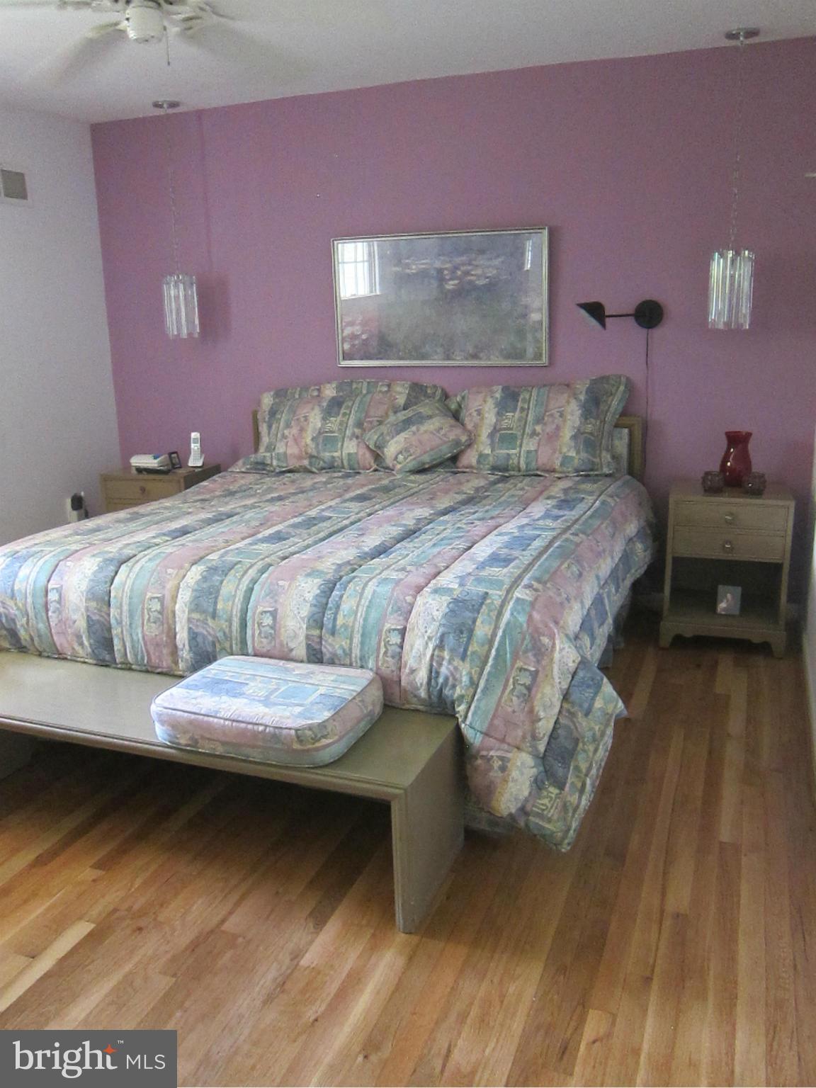 1803 Briggs Road Silver Spring, MD 20906 - Photo 19 of 19 a bedroom with a bed and a table