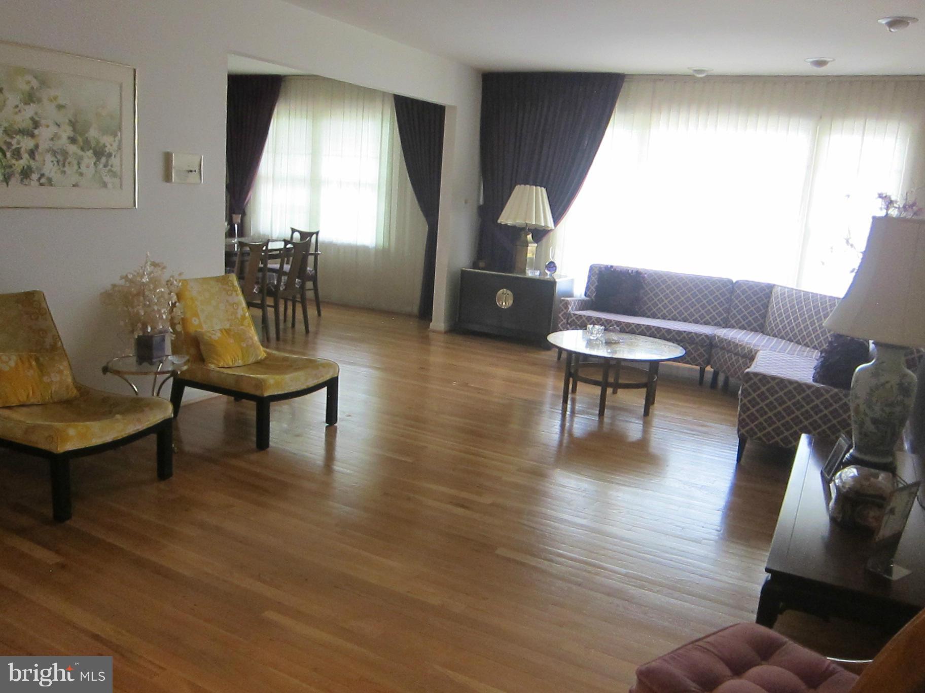 1803 Briggs Road Silver Spring, MD 20906 - Photo 4 of 19 a living room with furniture and a wooden floor