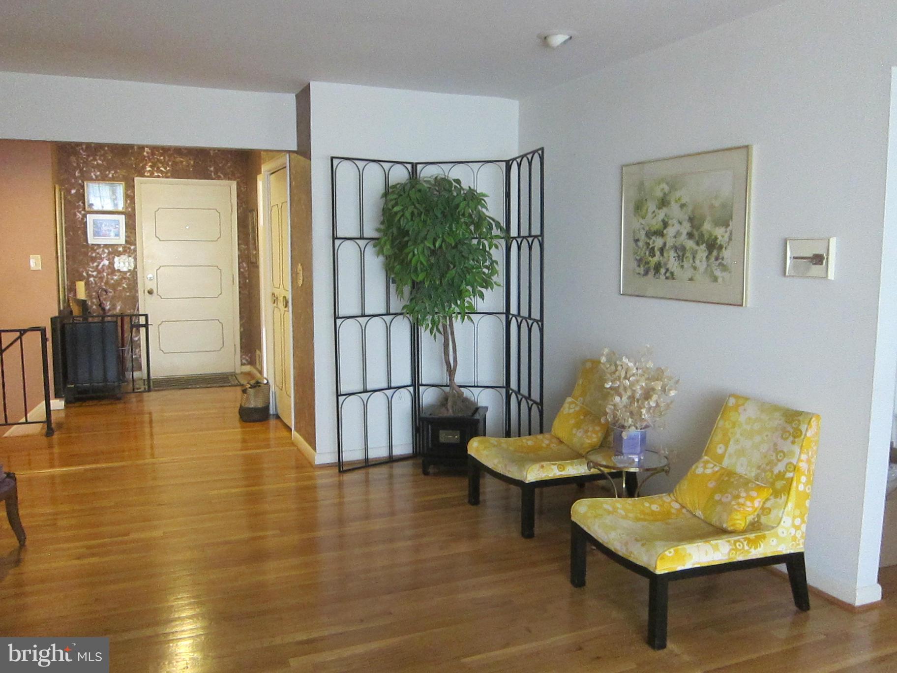 1803 Briggs Road Silver Spring, MD 20906 - Photo 5 of 19 a living room with furniture and a large window