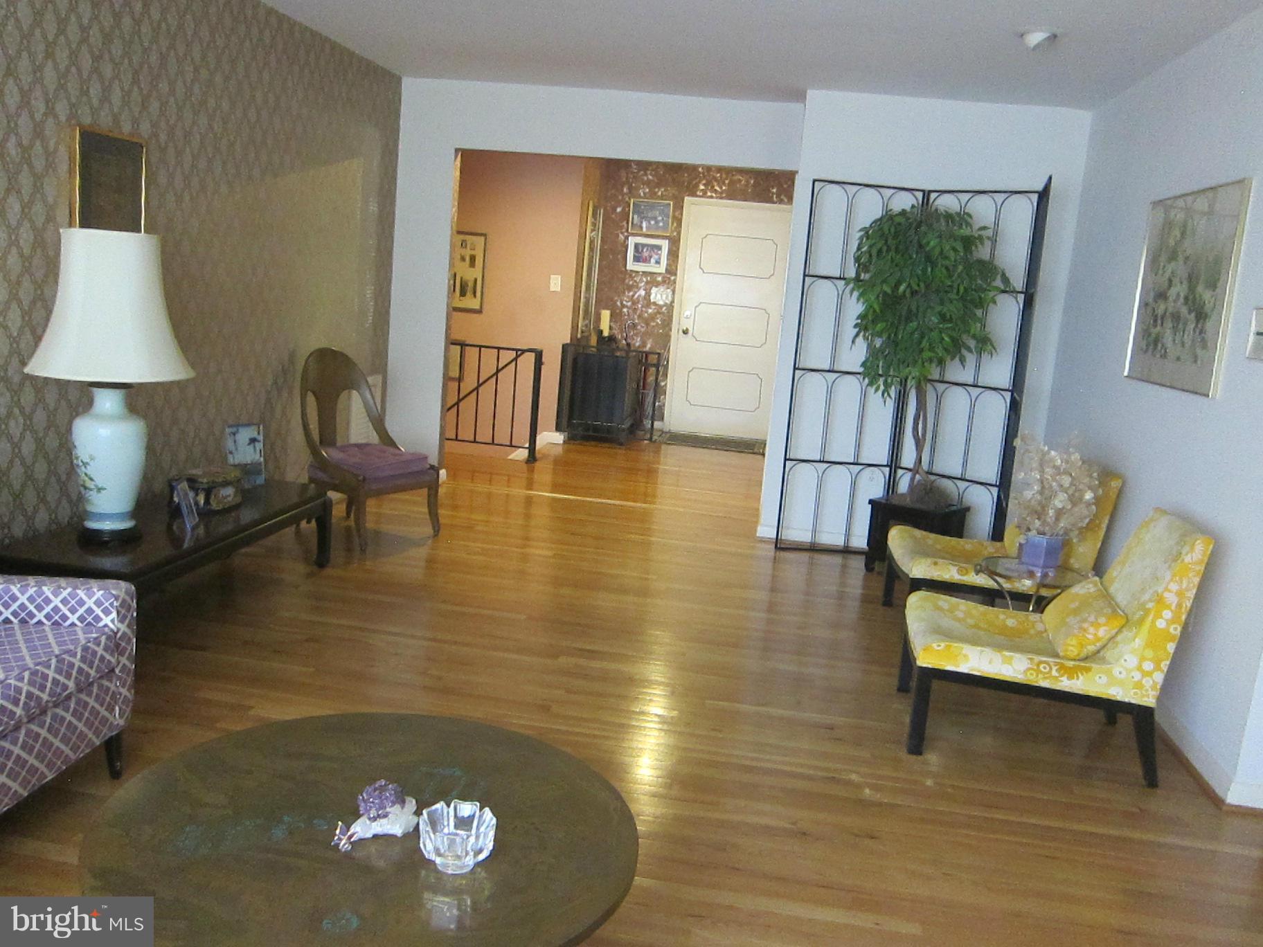 1803 Briggs Road Silver Spring, MD 20906 - Photo 7 of 19 a living room with furniture and a table