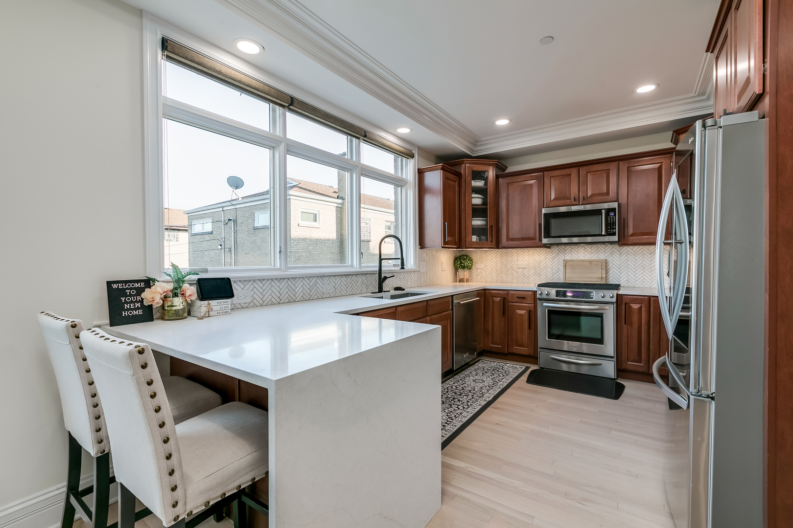 463 Summit Avenue, Unit D Park Ridge, IL 60068 - Photo 13 of 30 a kitchen with a stove a sink and a refrigerator